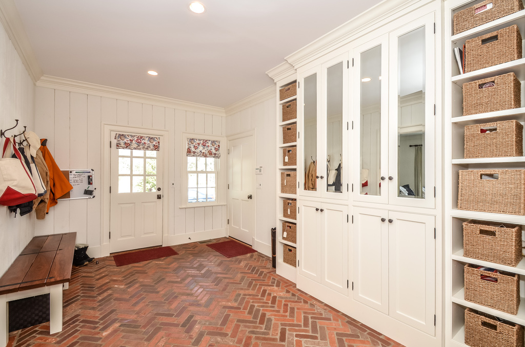 The Mudroom.  My favorite room! Great brick floor.  Tons of storage, and cabinetry to keep what you want out of sight!  Accessible to the 3 car garage and a back entrance for packages and little hockey players!