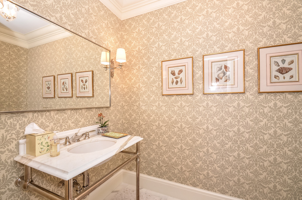 Its rare to take a peek at the powder room... but this one! Oh the wallpaper possibilities!  This paper is a pretty nice choice.