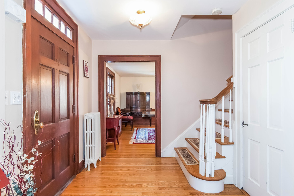 Generously proportioned foyer leads to dining room on one side...