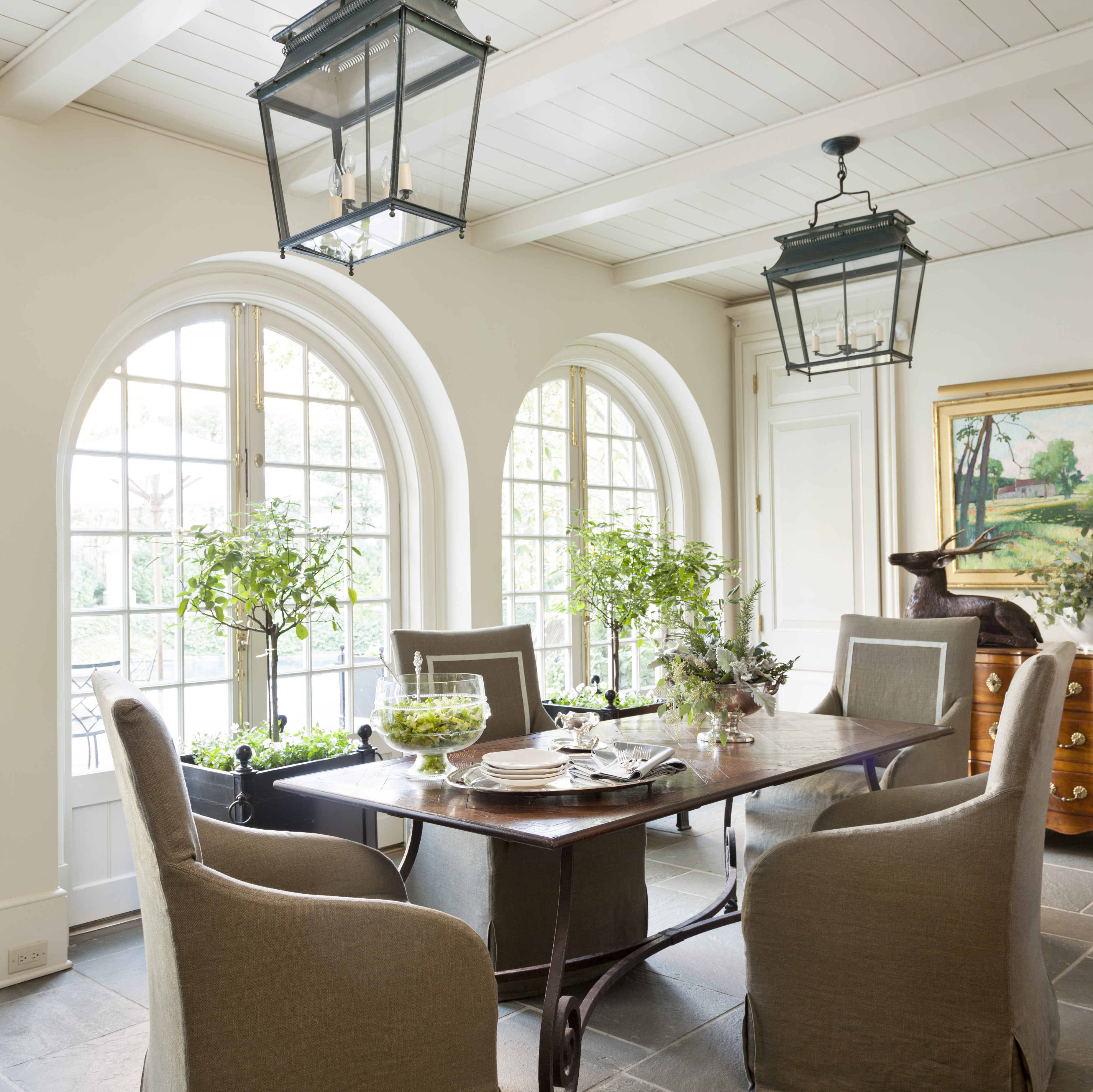 Lanterns, chandeliers, beautiful fabrics and special pieces of furniture all pull together the rooms in their houses.