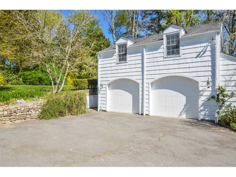 I love the garage doors.  And the stone wall that runs a long the side.