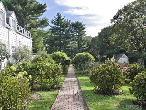 Garden paths and hedges are perfect for this property.  Love this example of what one can do.