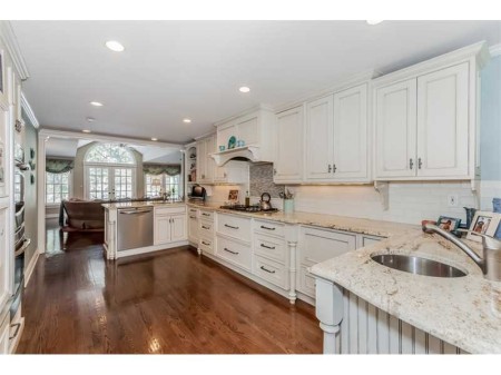 Kitchen works well for cooks.  Everyone else can hang on the other side of the island.