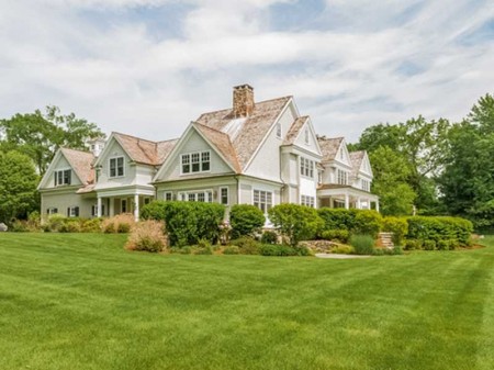 Beautiful lawn and gardens set back from the road.  Why look in Greenwich when you can land here!