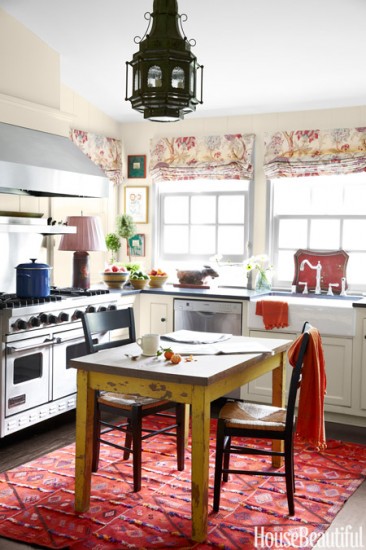 As I sit here dreaming about the Cornue range I hope to own some day, I think in the October 2014 issue of House Beautiful, this kitchen takes it! I am going with the cozy and colorful kitchen!