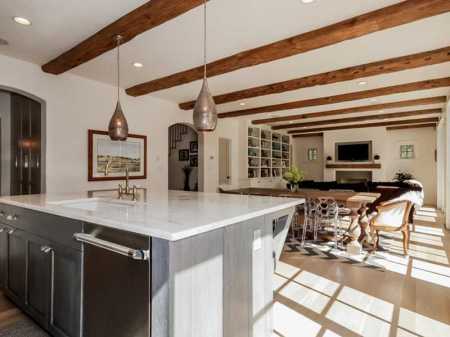 Kitchen that extends into a lovely reading and television seating area.