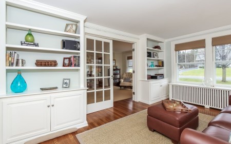 Nice details include built in bookshelves, and a screened in porch.